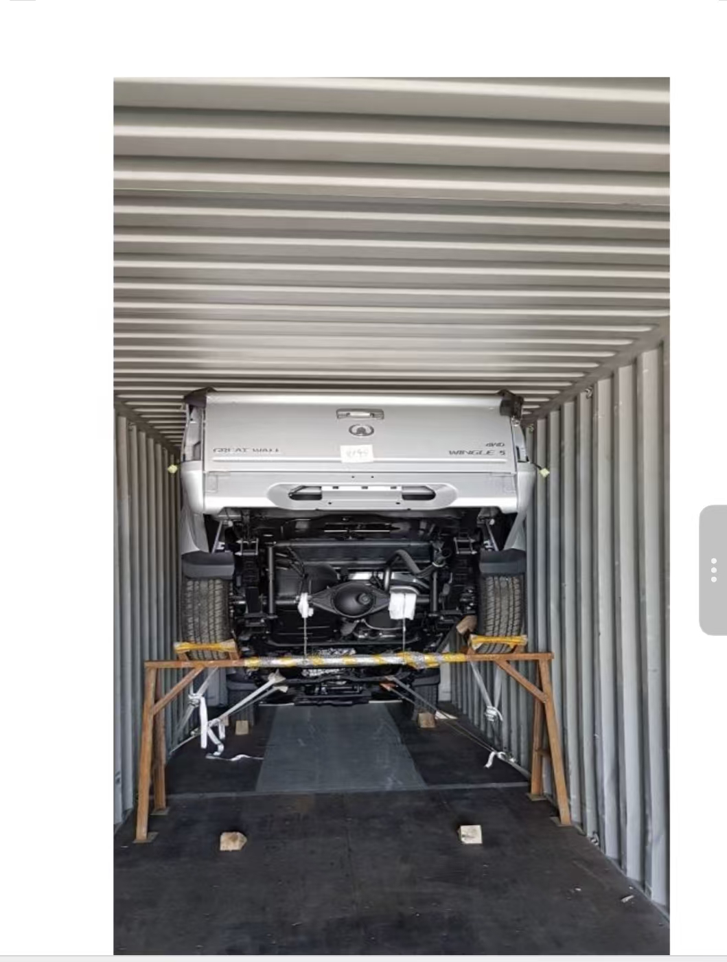 Partially disassembled pickup secured in a shipping container as a packing reference